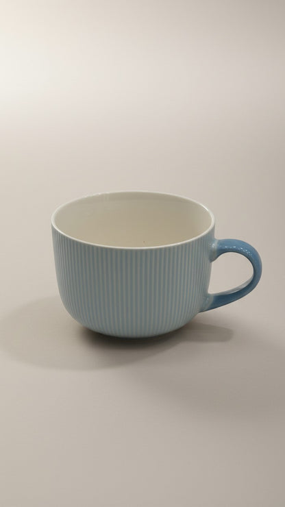 Asoula light blue ribbed ceramic soup mug with a comfortable handle. Perfect for enjoying your favorite hot beverages.