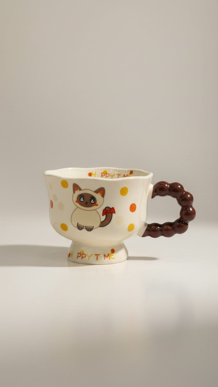 Asoula ceramic mug with a cute cartoon cat design and polka dots. Features a unique bubble handle and