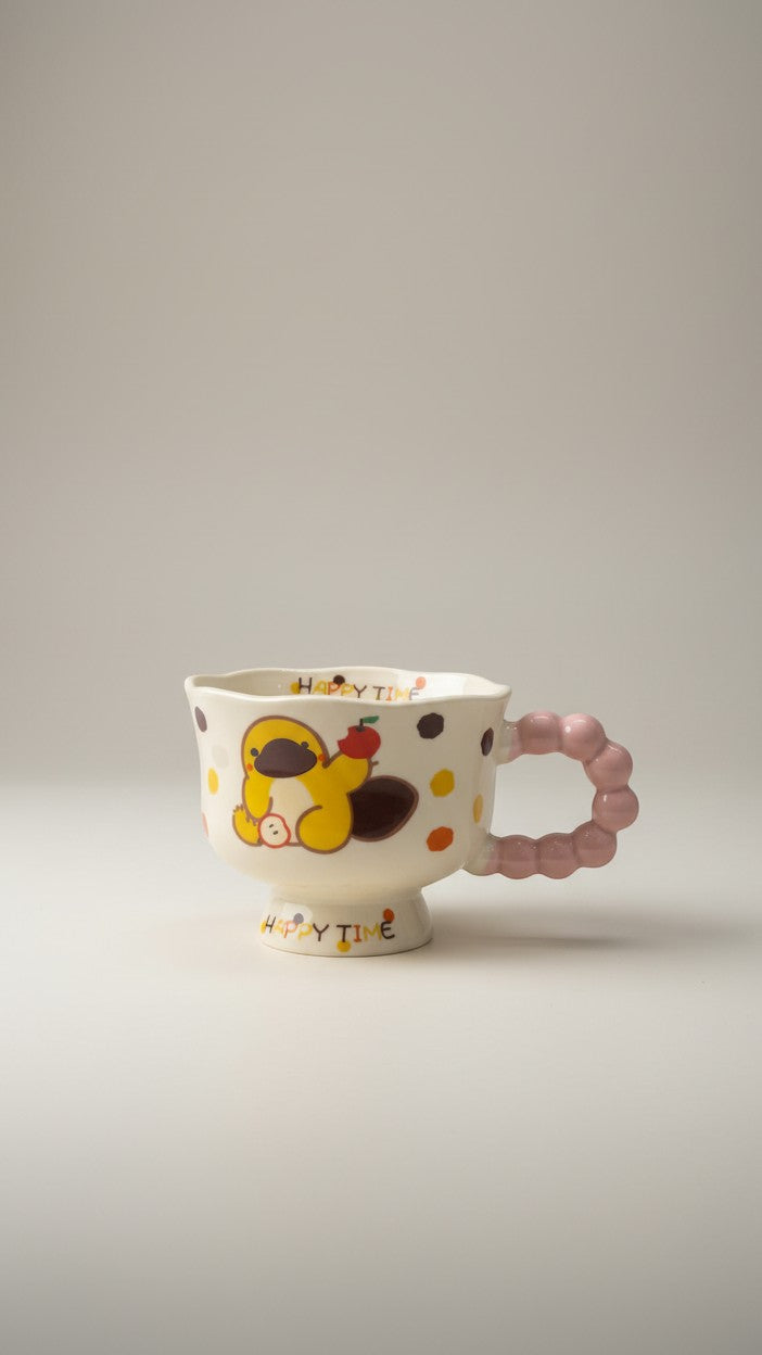 Asoula ceramic mug with a cute yellow cartoon character holding an apple, decorated with colorful polka dots and "Happy Time" text.