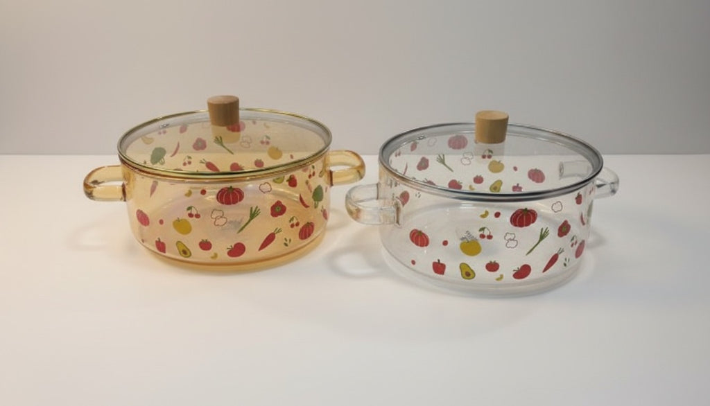 Asoula heat-resistant glass casserole dish with lid, featuring a playful vegetable and fruit pattern. Oven safe.