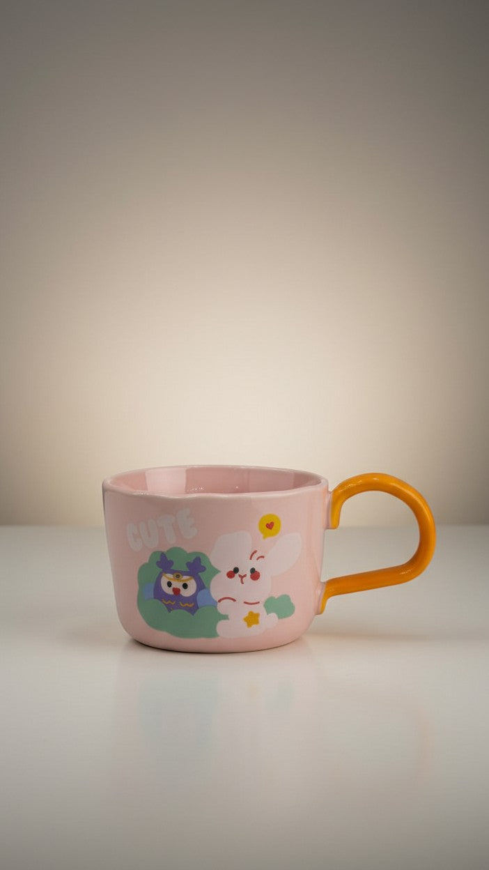 Asoula pink ceramic mug with cute cartoon bunny and owl design, featuring an orange handle.
