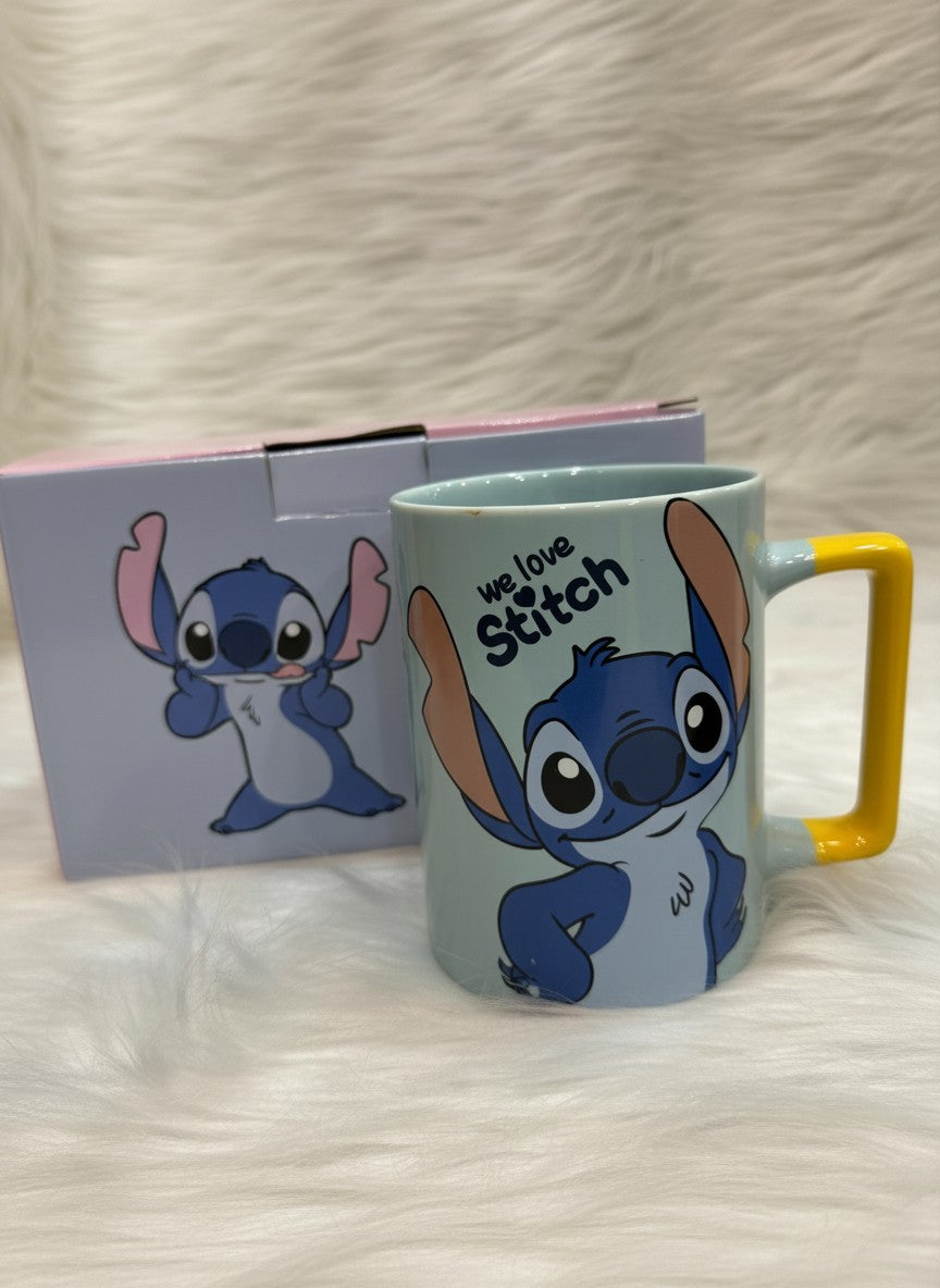 Asoula light blue ceramic mug featuring Stitch from Lilo & Stitch with yellow handle. Text reads "we love Stitch".