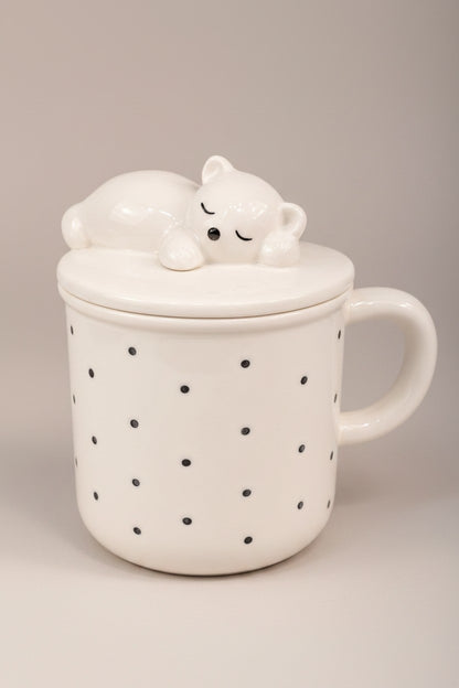 Asoula white porcelain mug with black polka dots and a lid featuring a sleeping bear.