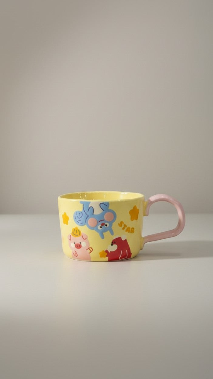Asoula yellow ceramic mug with cute cartoon pig, blue creature, and red animal designs. Pink handle.